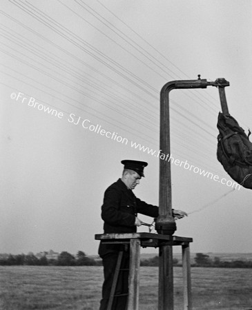 DANGLING MAILBAG WITH WORKER